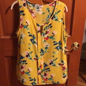 Yellow sleeveless floral shirt